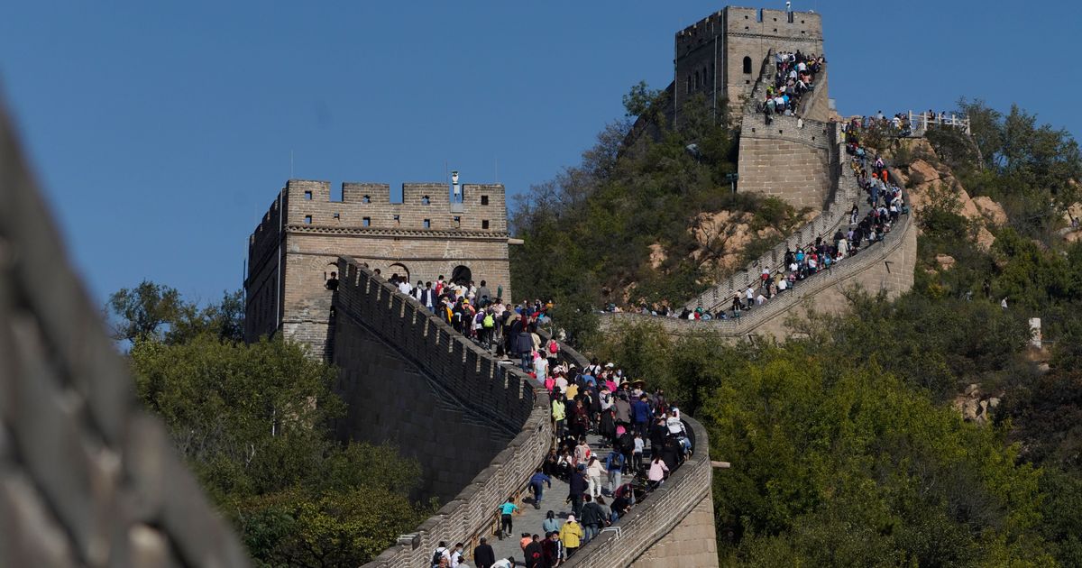 Officers say development staff stormed the Nice Wall of China in an effort to take a shortcut 2025